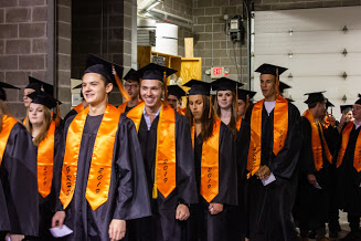 Images of graduates walking into ceremony