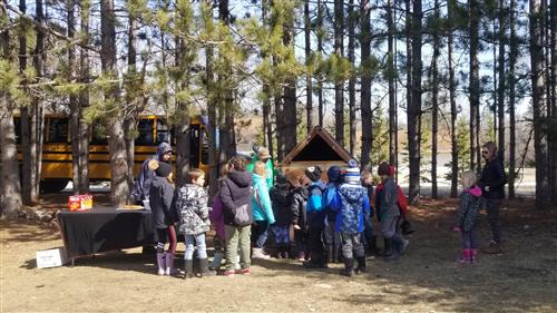 Students Learning About the Process of Smoking Fish at Culture Camp
