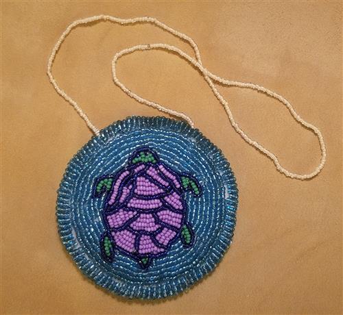 Mikinaak Medallion Created by GRHS Student